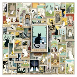 Close-up of cat tarot card stickers with vintage illustrations and Two of Wands card