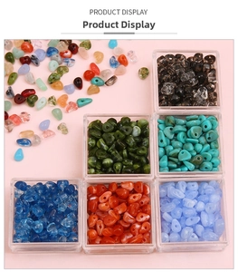 Close-up of irregular colorful acrylic beads set with a clear storage box for DIY crafts