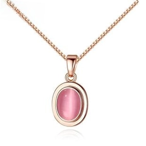Detail of rose gold heart necklace with oval pink gemstone and delicate box chain link