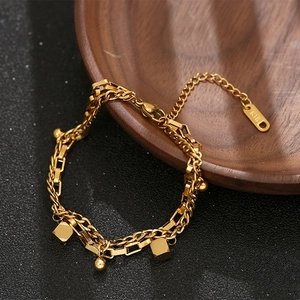 Double-layered K18 gold plated titanium steel bracelet with geometric cube and ball charms