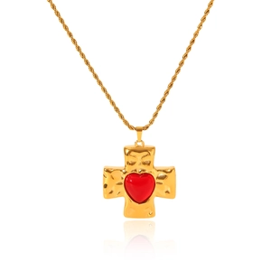 Close-up of golden hammered cross necklace with a red heart inlay on twisted rope chain