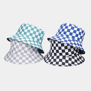 Detail of reversible checkerboard bucket hats showing various colors and sturdy fabric