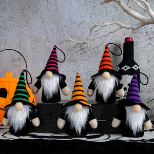 Five hanging Halloween faceless gnomes with striped hats and warm glowing LED lights