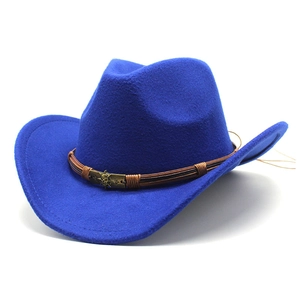 Close-up of royal blue wool cowboy hat with leather band and bronze skull detail