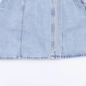 Short denim dress in light blue wash with detailed stitching and high-quality denim texture
