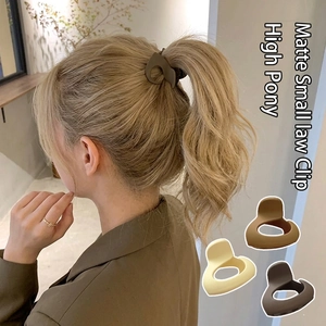 Matte small hair claw clips in khaki and brown for high ponytail styling on women