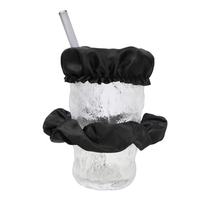 Detail of black satin drink cover scrunchie set on glass cup with straw in studio light