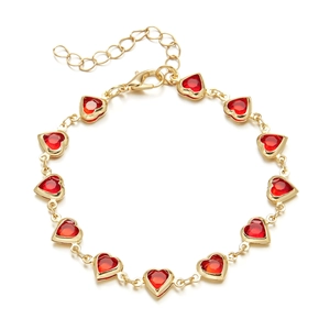 Detail of red heart beads on gold chain with lobster clasp and adjustable extender
