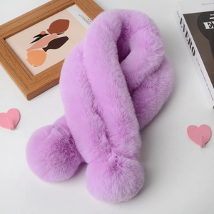 Detail showing plush faux rabbit fur texture of a purple winter scarf in an aesthetic setting