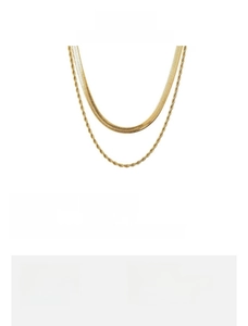 Detail of layered gold stainless steel snake and twist chains with specific length metrics