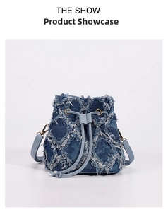 Detail of tie-dye denim bucket bag featuring distressed fringe diamond patterns