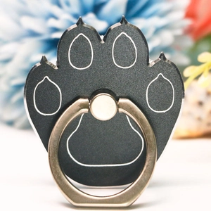 Detailed view of a black cat paw shaped metal ring holder for mobile phones