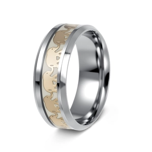 Polished silver stainless steel ring with golden elephant pattern band on white background