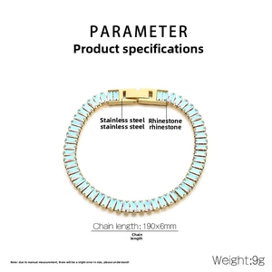 Detail of golden stainless steel bracelet with rectangular blue rhinestones and fold-over clasp