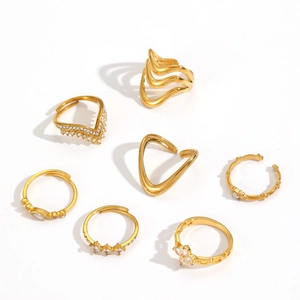 7-piece gold stainless steel jewelry set with stacked rings and cubic zirconia accents