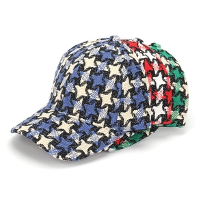 Close-up of thick plaid tweed baseball caps in blue, red and green for winter