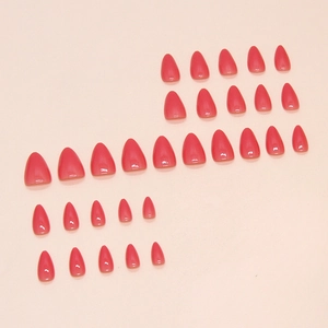 Glossy red gradient stiletto press-on nails set in various sizes on pink background