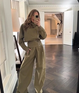 Olive green two-piece cargo set with cropped zip jacket and wide-leg utility trousers