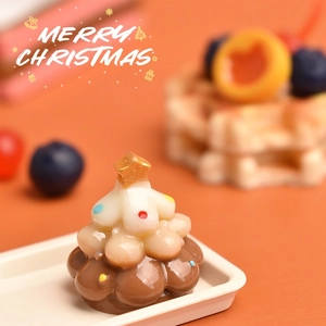 Detailed view of mini Christmas tree resin ornament with colorful beads and golden star