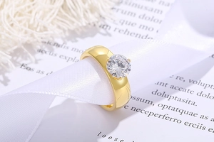 Close-up of a 6mm round zircon stone on a gold titanium steel ring with silk ribbon