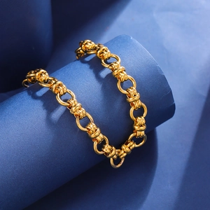 Macro shot of 11mm gold titanium steel chain with detailed textured threaded links