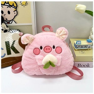 Detail of pink plush cartoon pig backpack featuring a cute character holding a peach