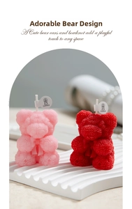 Detail of rose-textured bear scented candles in pink and red with bow accents