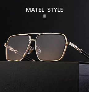 Close-up of square metal frame sunglasses with gradient lenses and a double bridge