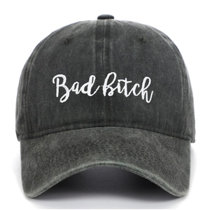 Close-up of Bad Bitch script embroidery on a washed charcoal grey cotton baseball cap
