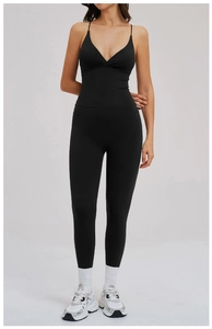Detail of black V-neck athletic tank top and high-waist leggings on model