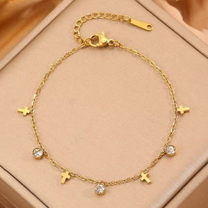Elegant gold titanium steel bracelet featuring cross charms and sparkling zircon crystals