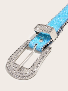 Detail view of blue glitter belt with shimmering rhinestones and silver metal buckle
