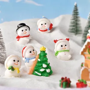 Miniature resin Christmas snowmen set with a snowy tree for festive landscape decor