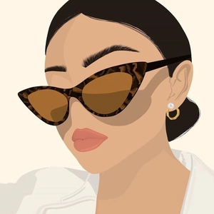 Detail of C-shaped textured earrings with white pearls and tortoiseshell cat-eye sunglasses