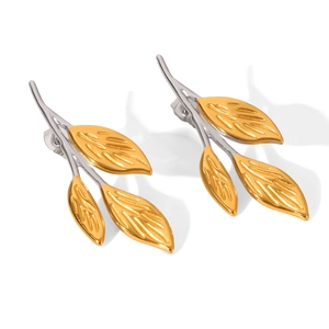 Detail view of leaf-shaped stainless steel stud earrings in gold and silver finish