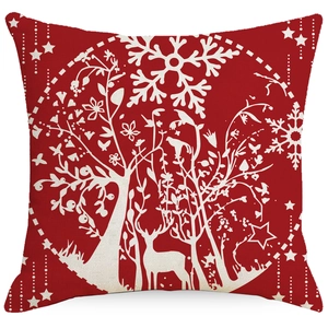 Red Christmas linen pillowcase with white reindeer and snowflake motifs on white background