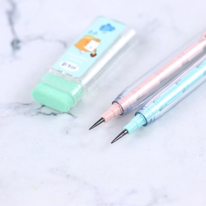 Close-up of pastel mechanical pencils and lead case on a marble surface background