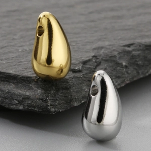 Polished gold and silver titanium steel water drop pendants in a sleek minimalist style