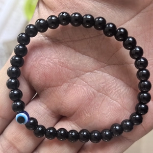 6mm natural black stone bead bracelet with blue evil eye charm for men on hand