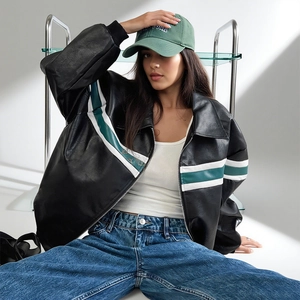 Oversized black distressed faux leather jacket with zippers in American street style