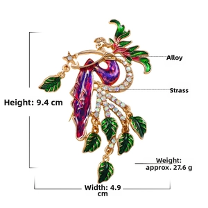 Detail view of fairy brooch in gold finish with purple enamel and white rhinestones