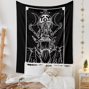 Detail of Bohemian The Moon tarot tapestry with mystical black and white theme on wall
