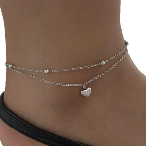 Double-layer stainless steel anklet with beaded chain and heart charm on ankle