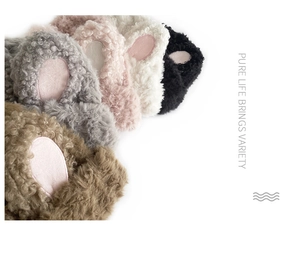 Close-up of plush bunny ear accessories in five soft colors with fuzzy texture