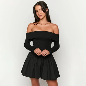Detail of off-shoulder mini dress featuring ribbed knit bodice and pleated skirt