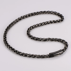 Close-up of vintage oxidized stainless steel keel chain with magnetic cylinder clasp