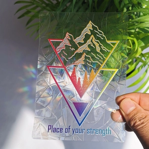 Detailed holographic suncatcher sticker featuring geometric mountain and forest pattern