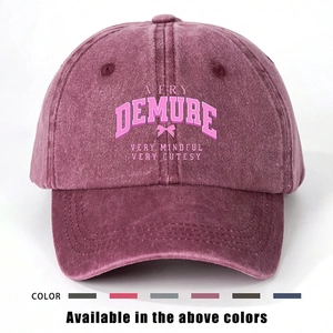 Detail of burgundy washed cotton baseball cap with Very Demure embroidery and bow design