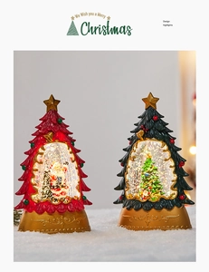 Light-up Christmas tree snow globe with Santa scene and golden embossed base
