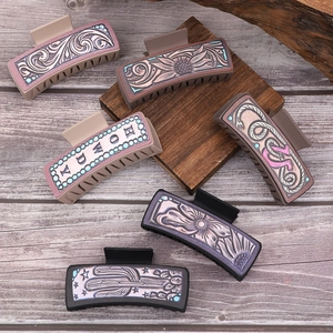 Vintage western cowboy leather hair claws with howdy text and cactus patterns